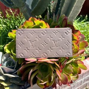 Authentic Louis Vuitton zip pouch empreinte leather turtledove